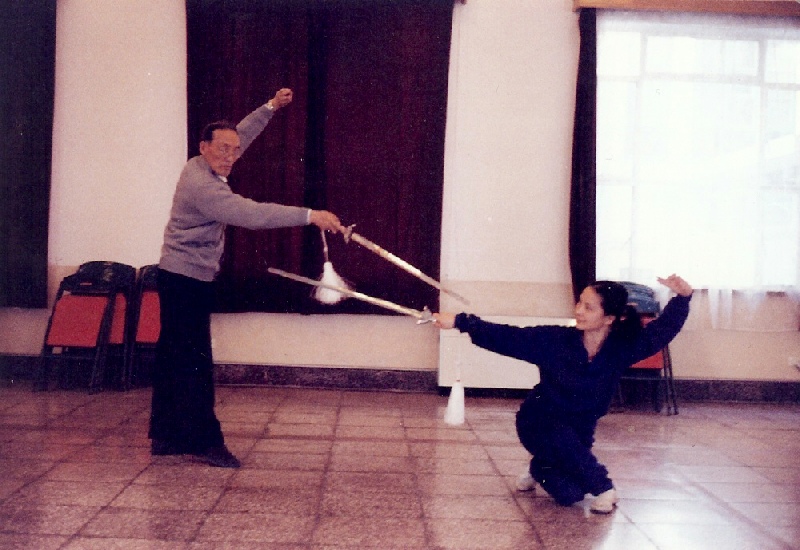 A picture containing floor, person, indoor, sword
Description automatically generated